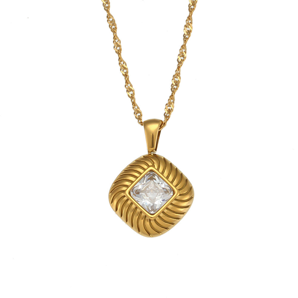 isolated gold plated square pendant necklace with a clear stone