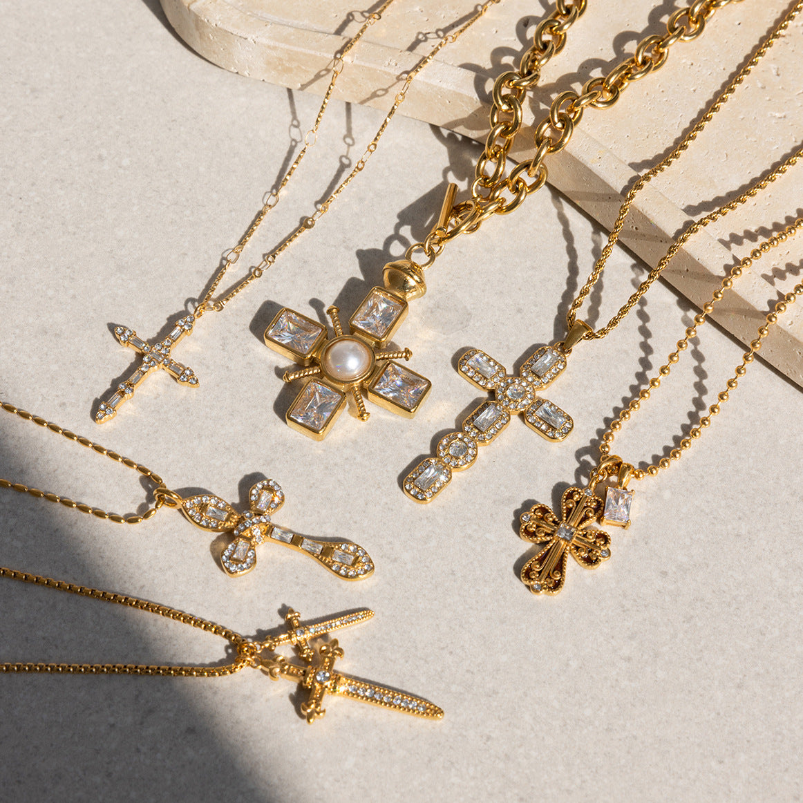 Cross pendants with varied chain and accent designs
