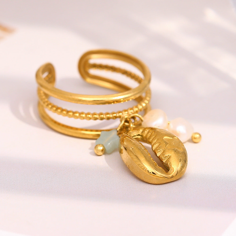 gold plated cowrie charm open ring with pearls and blue star bead