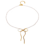 Full bead necklace with long-tailed bow pendant