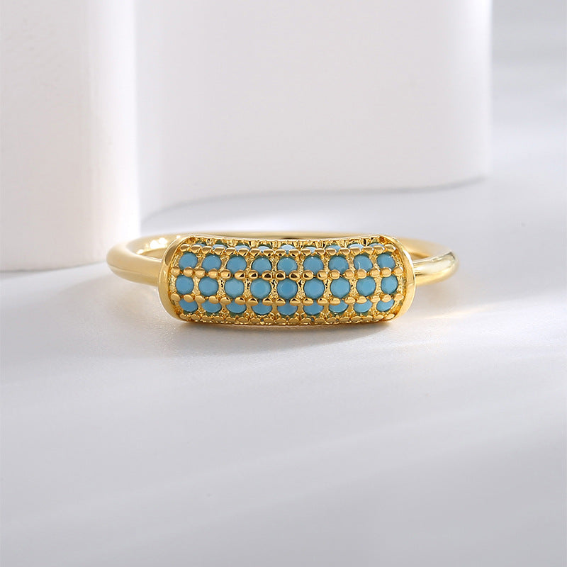 low front angle of elongated turquoise-color lattice ring