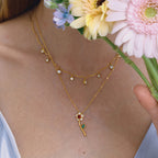 red rose necklace paired with a clear-stone station chain