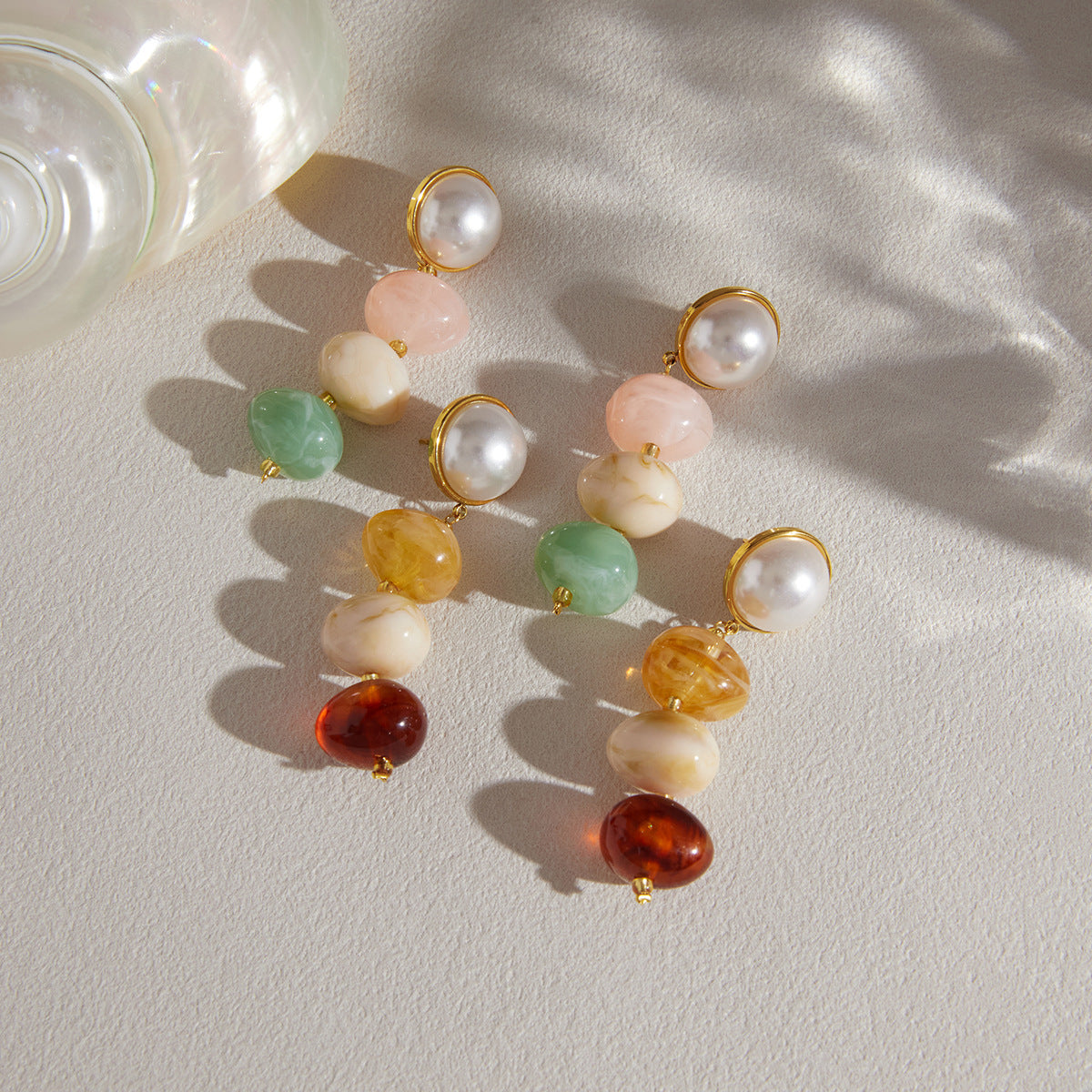 Two resin colorways arranged on a pale surface