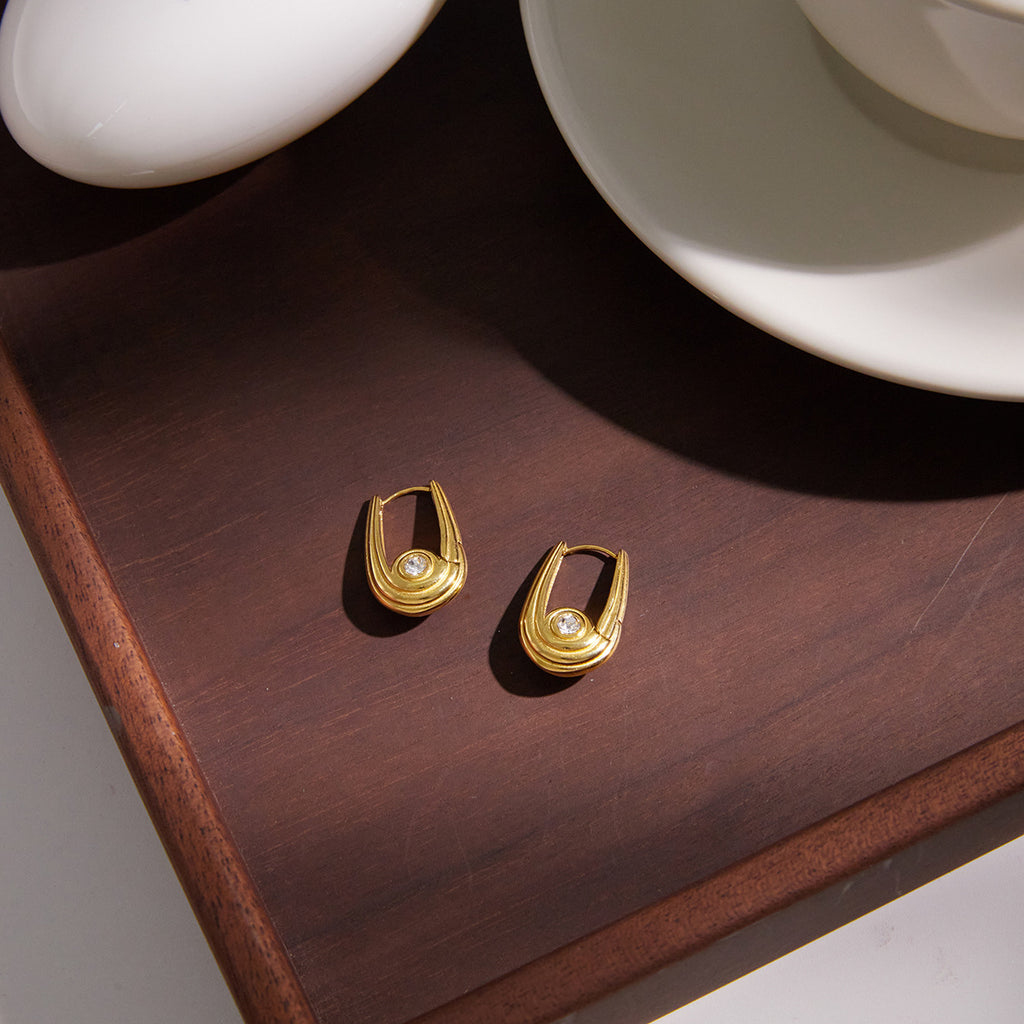 pair of gold plated U-frame rhinestone huggie earrings