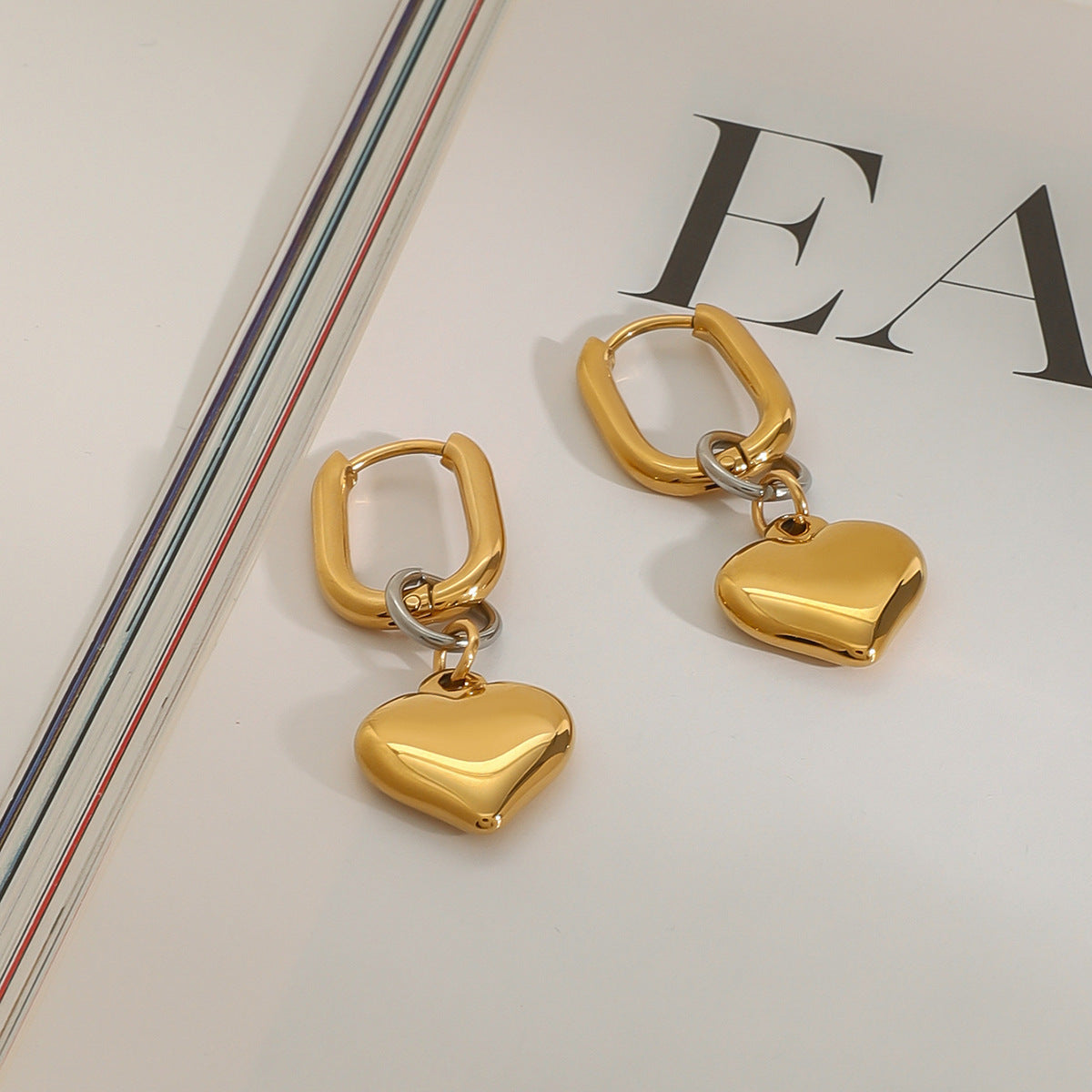 Gold-Tone Heart Charm Stainless Steel Hoop Earrings on-model view