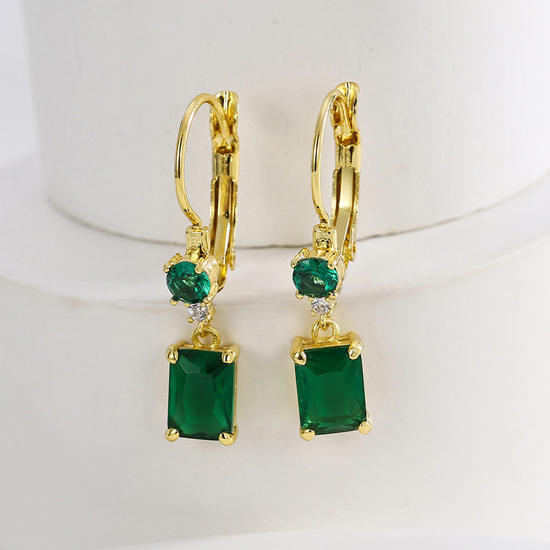 pair of round and emerald-cut green zirconia drop earrings