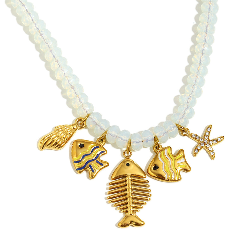 Fishbone charm necklace with shell and starfish details