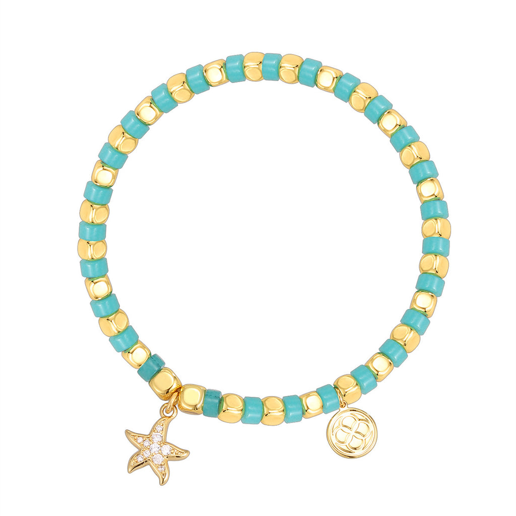 gold plated starfish bracelet on a white background