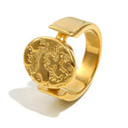gold plated celestial signet ring with round relief face and polished bridge