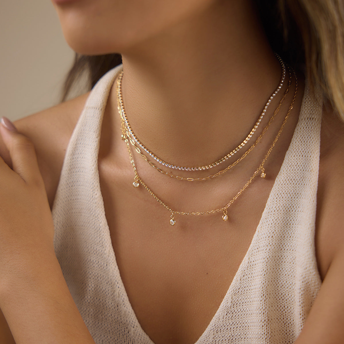 Three-layer necklace shown on model from side