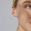 gold plated triple-band clip-on ear cuff worn on the outer ear