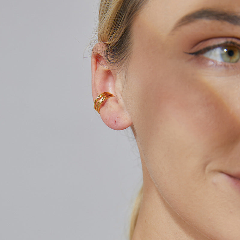 gold plated triple-band clip-on ear cuff worn on the outer ear