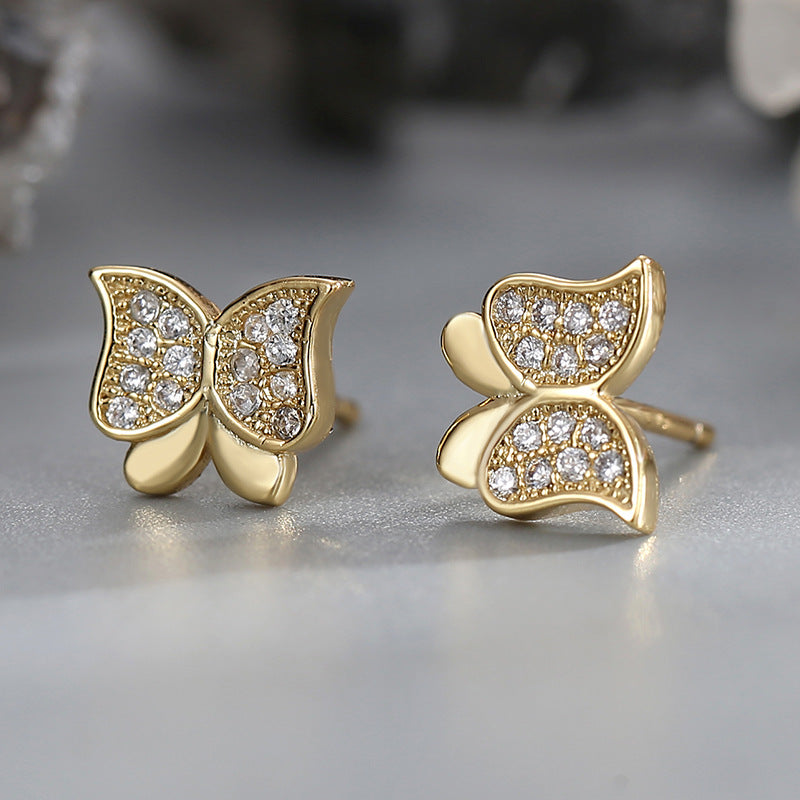 gold plated butterfly zirconia stud earrings in close-up