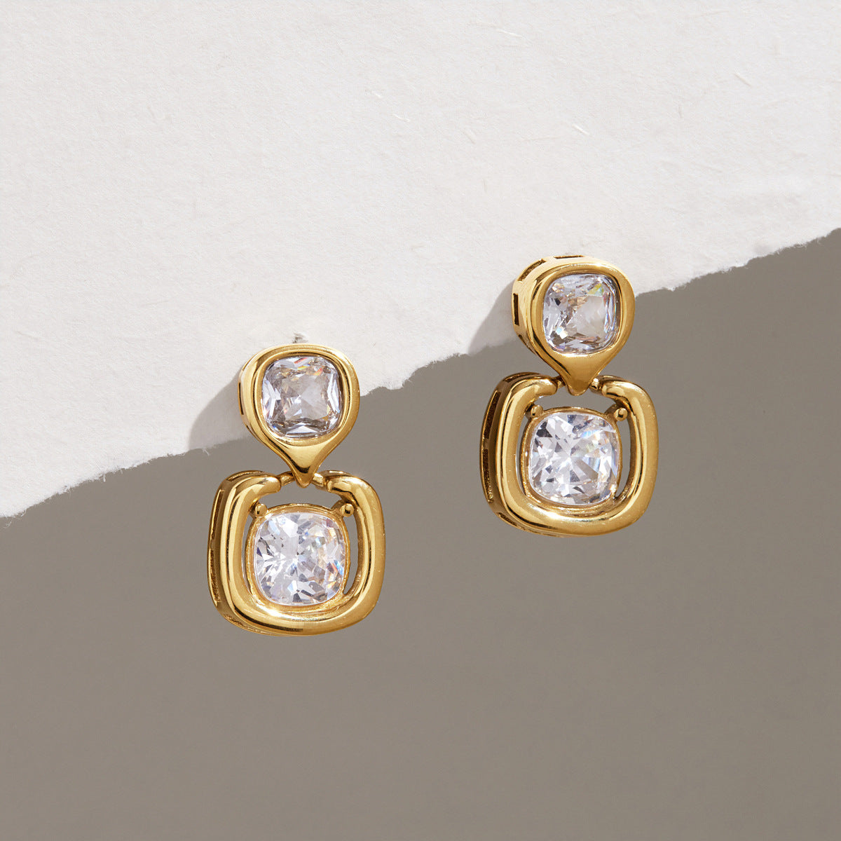 Pair of clear-accent double-drop earrings on stone