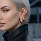 Wide multicolor zirconia hoop earrings worn on ear