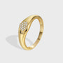 isolated gold plated heart signet ring with clear zirconia