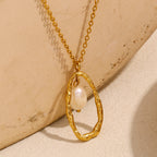 angled view of suspended white bead inside a textured open oval
