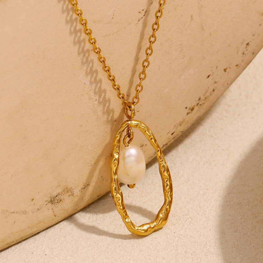 angled view of suspended white bead inside a textured open oval