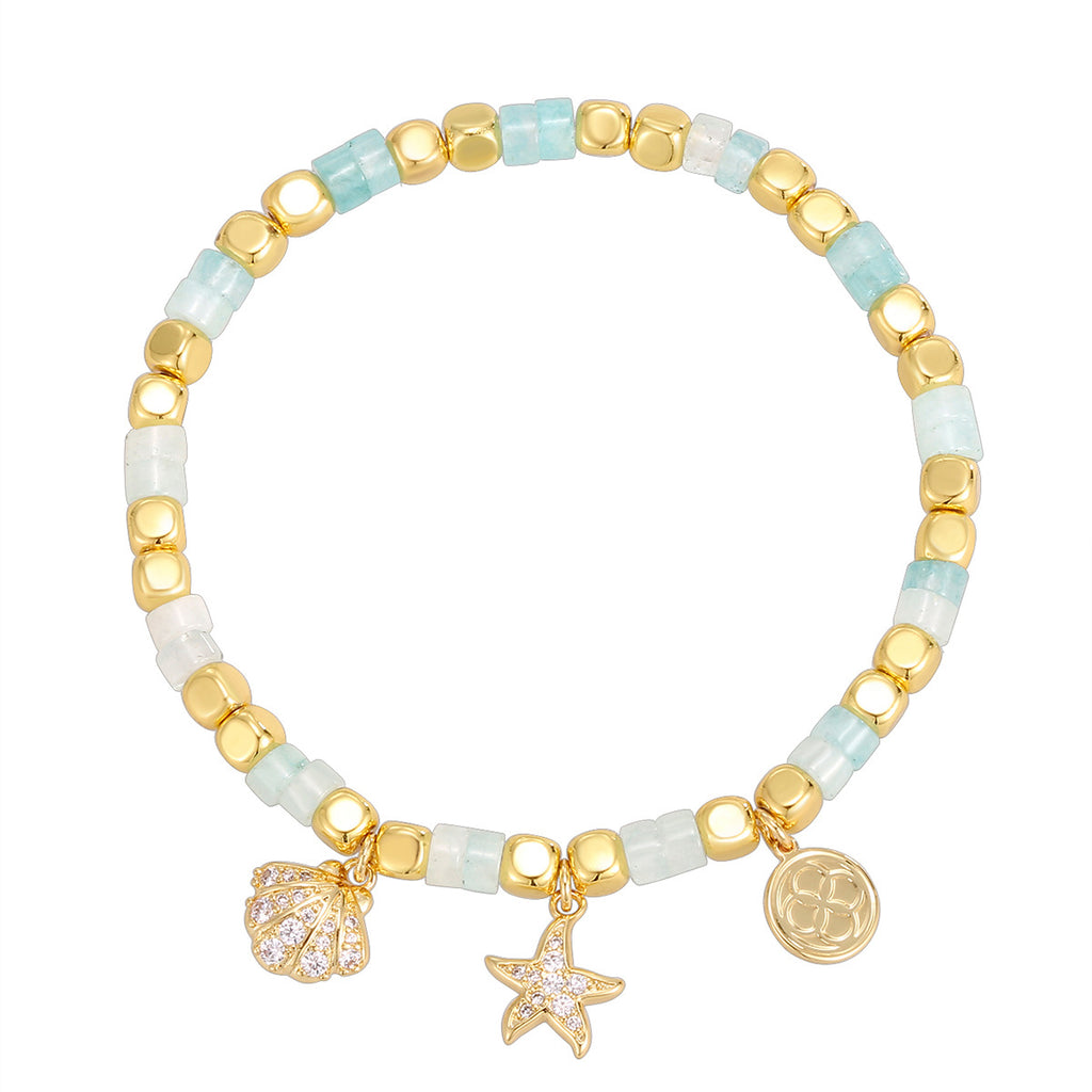 gold plated coastal beaded bracelet on a white background