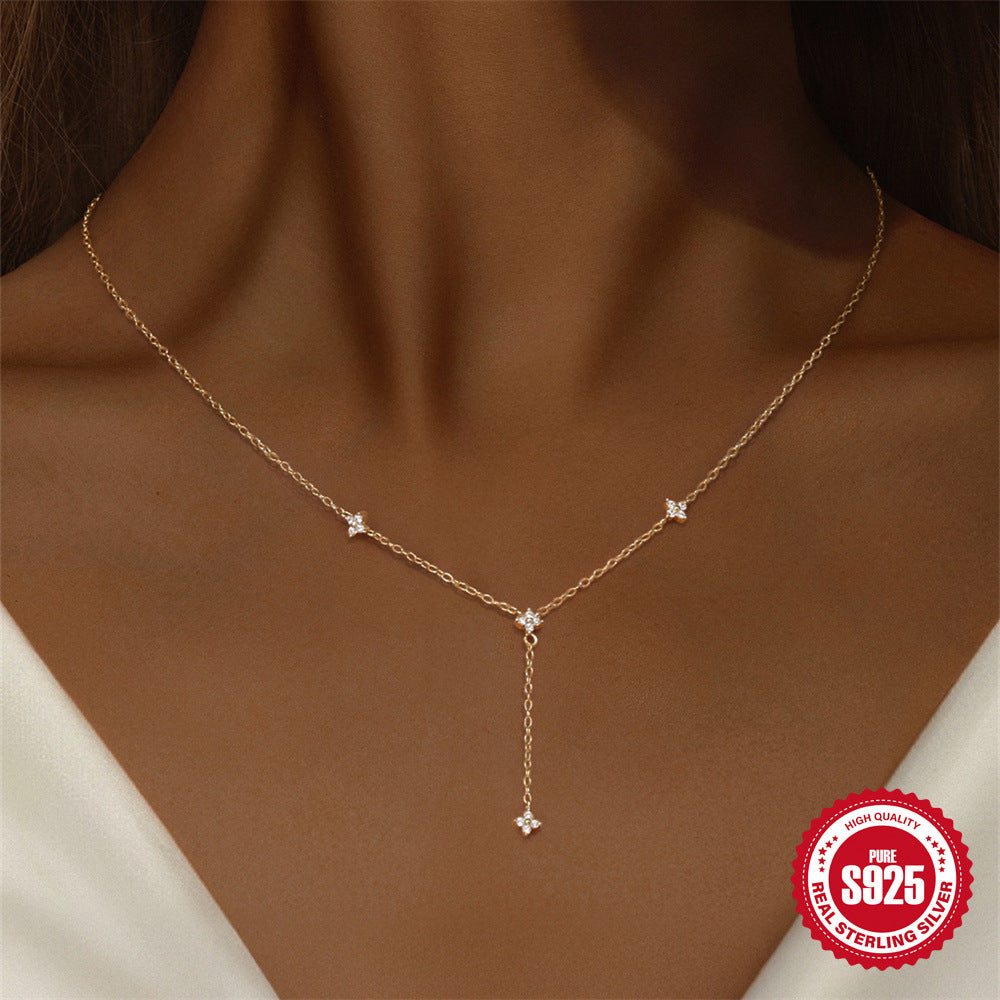 front-worn Y necklace with small floral zirconia stations
