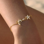 Crab and starfish chain bracelet worn close-up