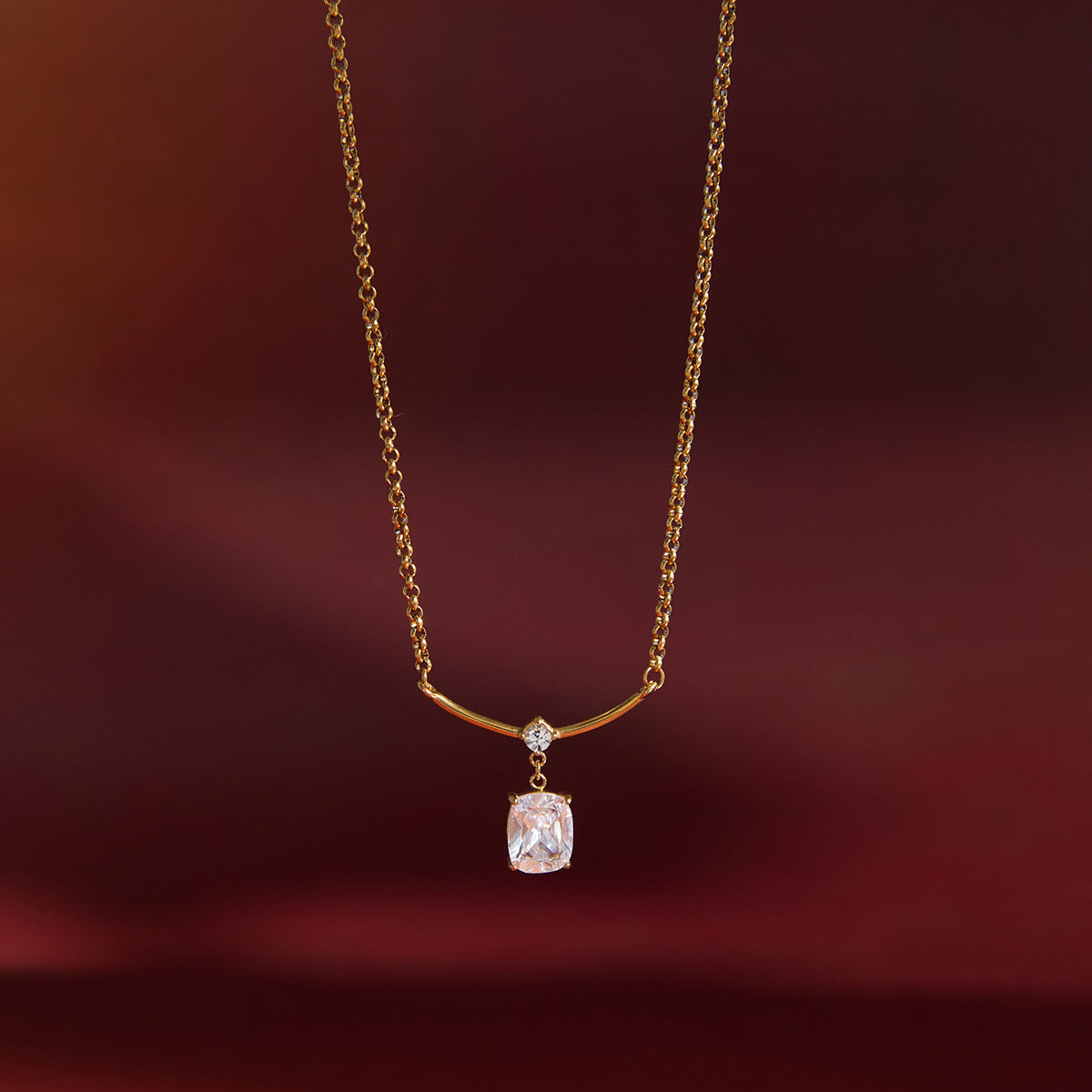 gold plated necklace with round and cushion-cut clear accents