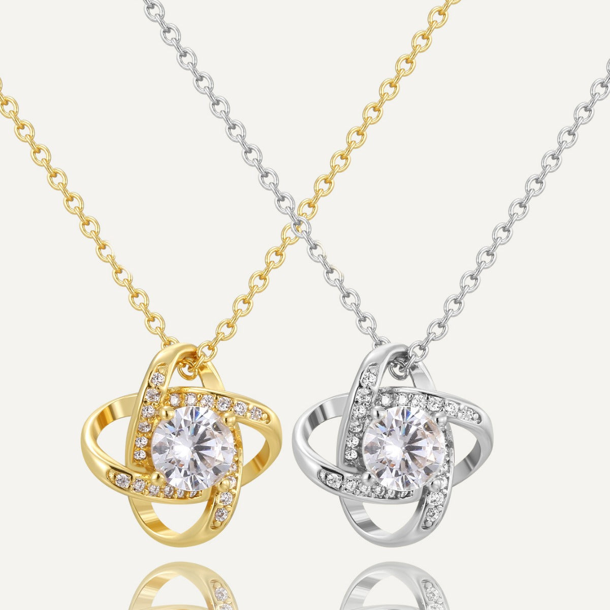 gold plated and silver-finish orbit pendant necklaces with clear stones