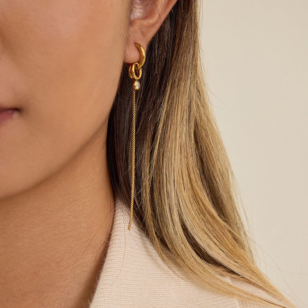 Gold-Tone Pearl-Look Tassel Stainless Steel Hoop Earrings shown on model