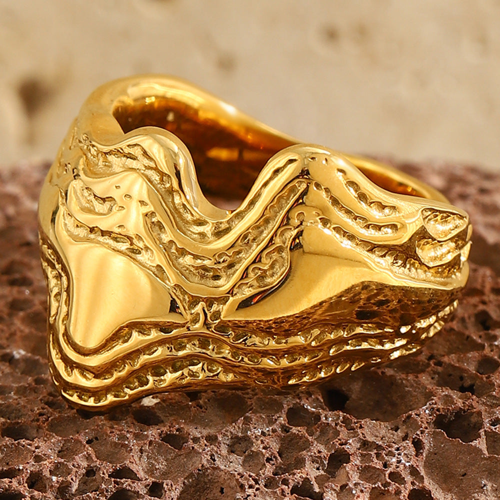 close view of raised dotted contours on the sculptural wave ring