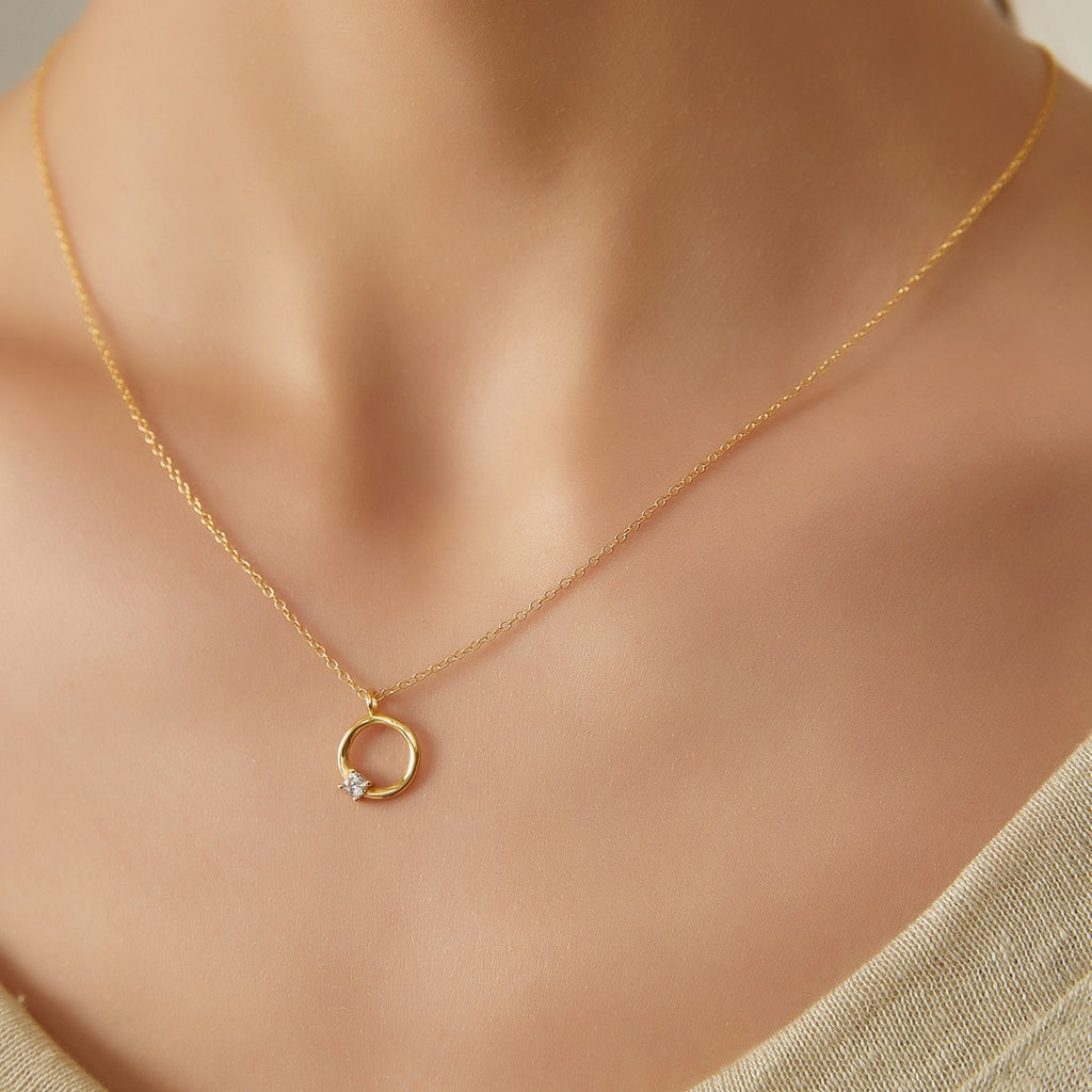 model wearing a petite gold plated open circle necklace