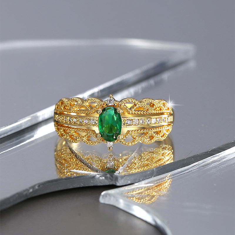 front studio view of the green and clear stone ornate ring