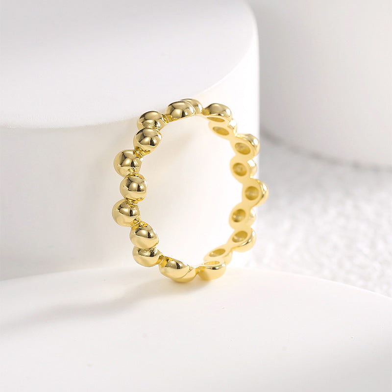 upright gold plated pebble ring showing linked construction