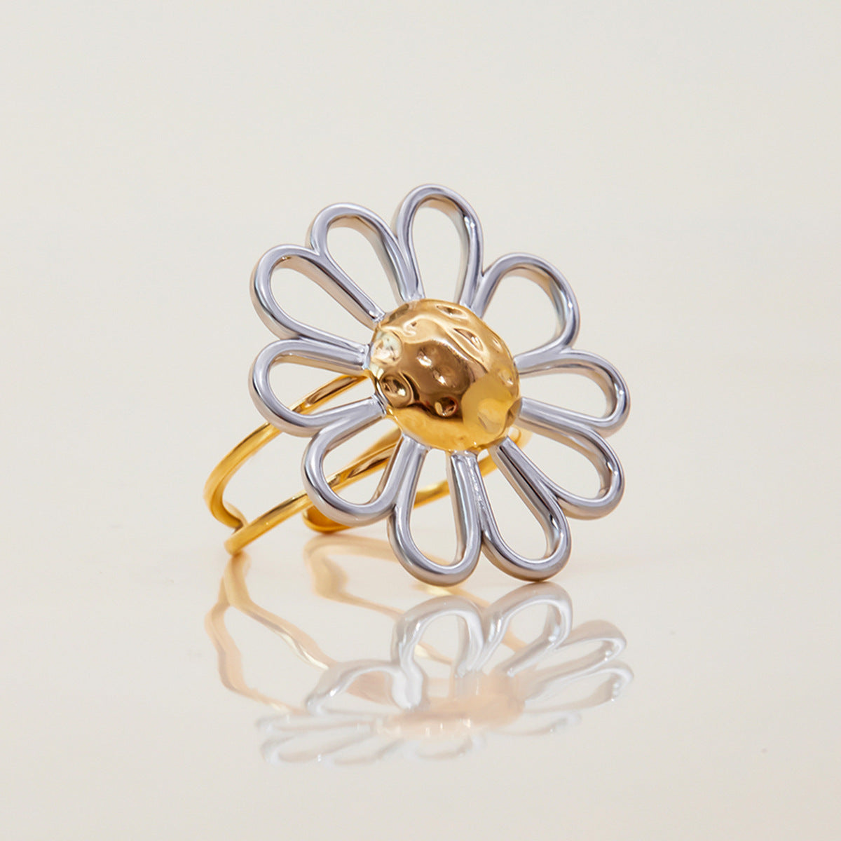 Front view of sculptural stainless steel flower ring