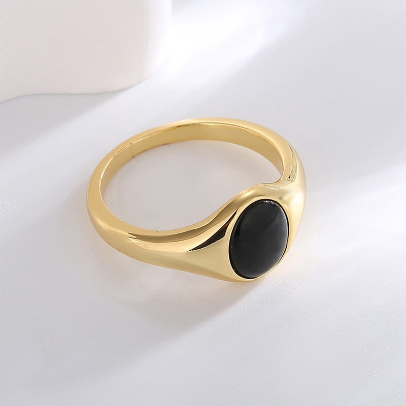 angled side view of the gold plated black resin ring