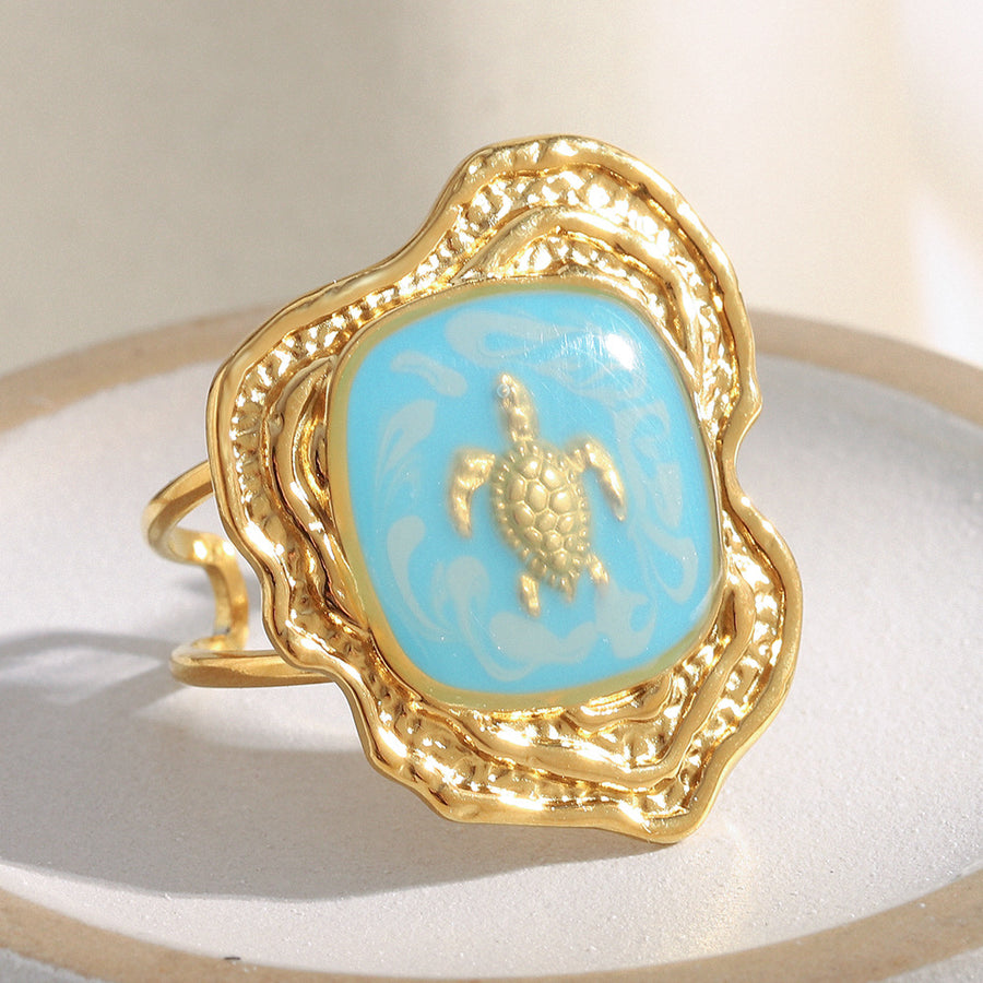 gold plated turtle open ring with turquoise-blue enamel panel