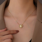 model wearing the gold plated compass star medallion necklace
