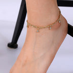 gold plated link anklet with five bezel-set zirconia charms