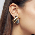 Sculptural X Stainless Steel Stud Earrings in Two Finishes shown on model
