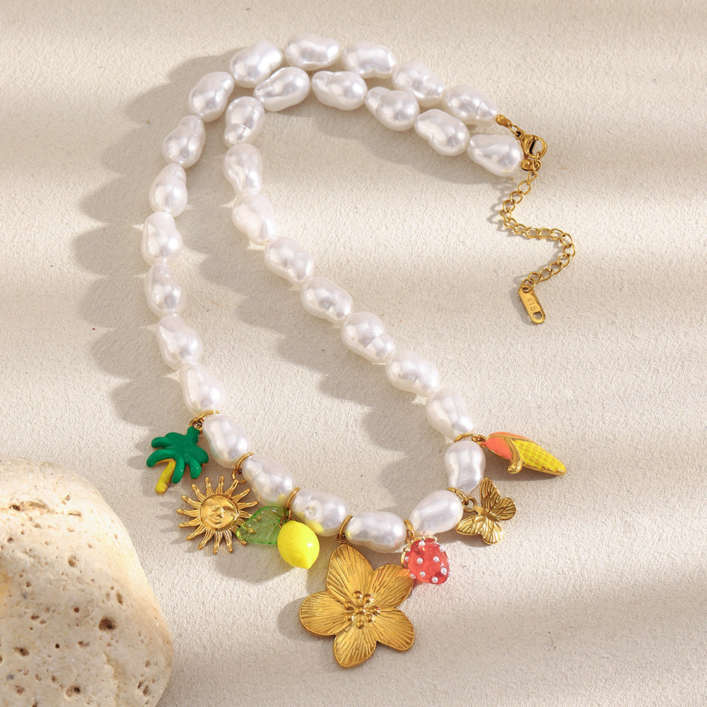Full pearl-look bead necklace with botanical and fruit accents