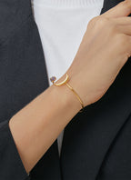 model styling the gold plated crescent purple stone cuff