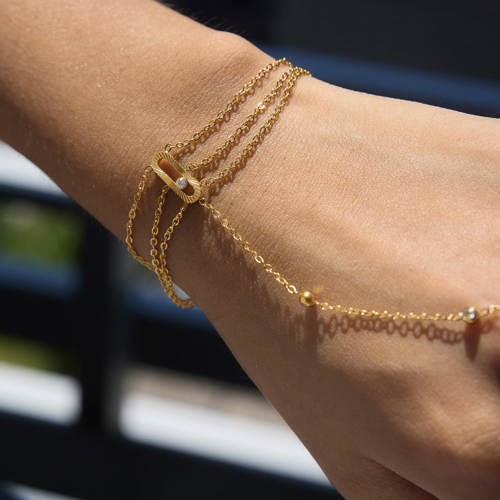 Close-up of wrist chains and the chain across the hand