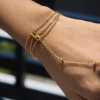 Close-up of wrist chains and the chain across the hand