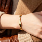 minimalist gold plated twisted cuff bracelet worn on the wrist