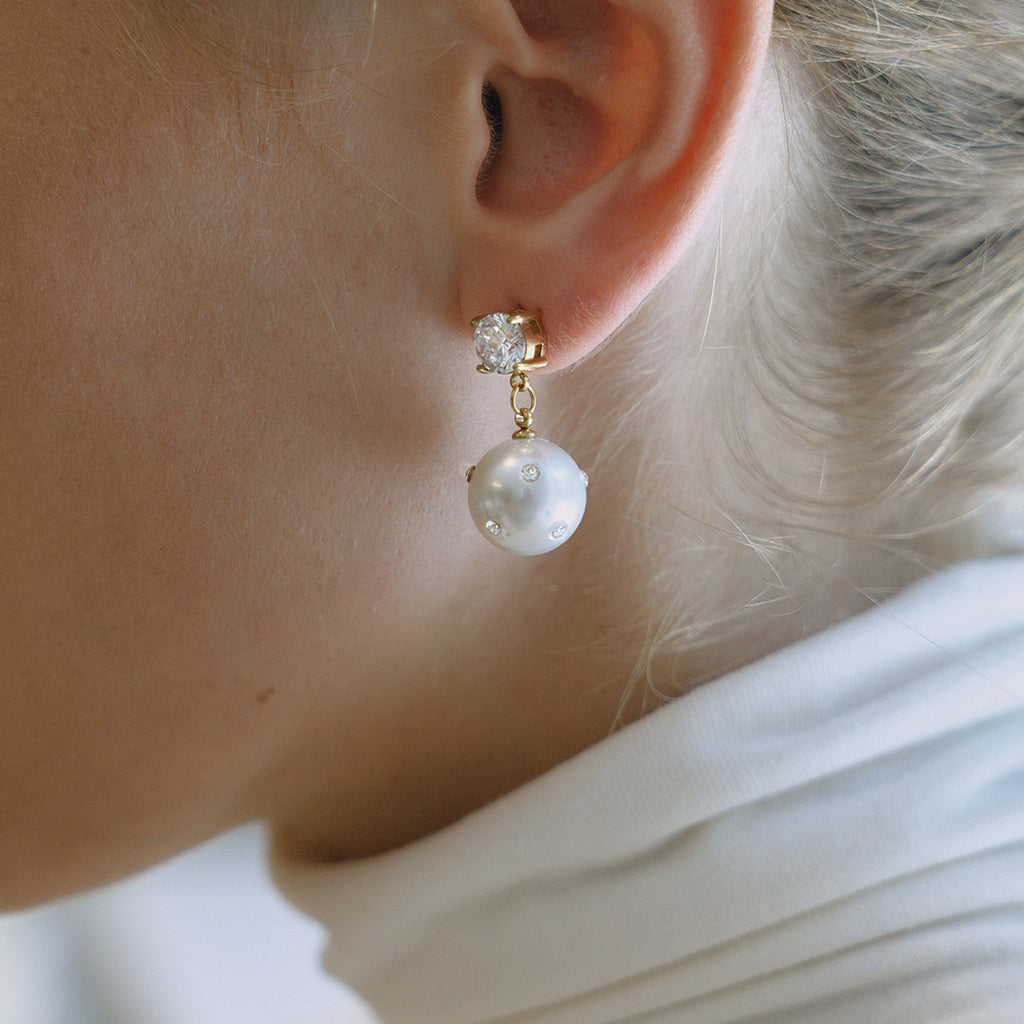 Imitation Pearl and Clear Stone Stainless Steel Drop Earrings — side view of the clear stone studs