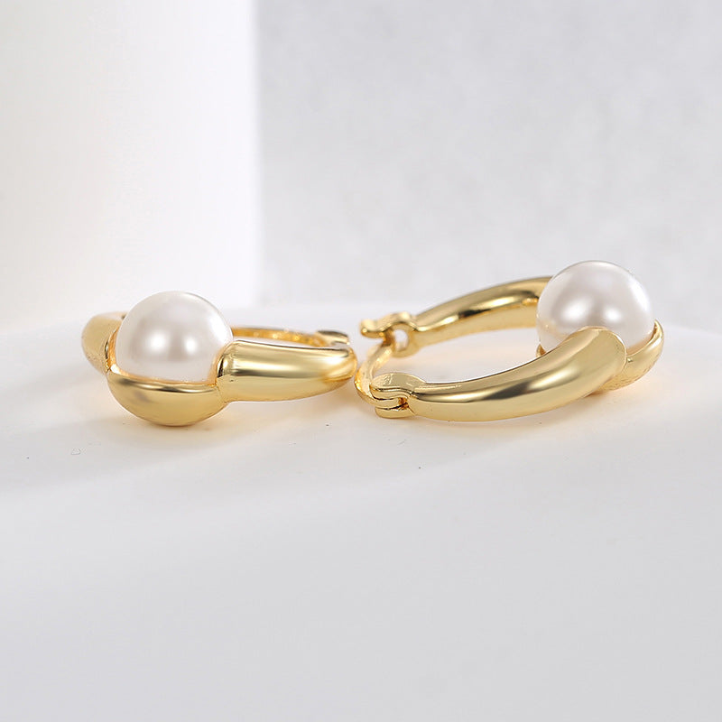 gold plated brass shell pearl huggie hoop earrings