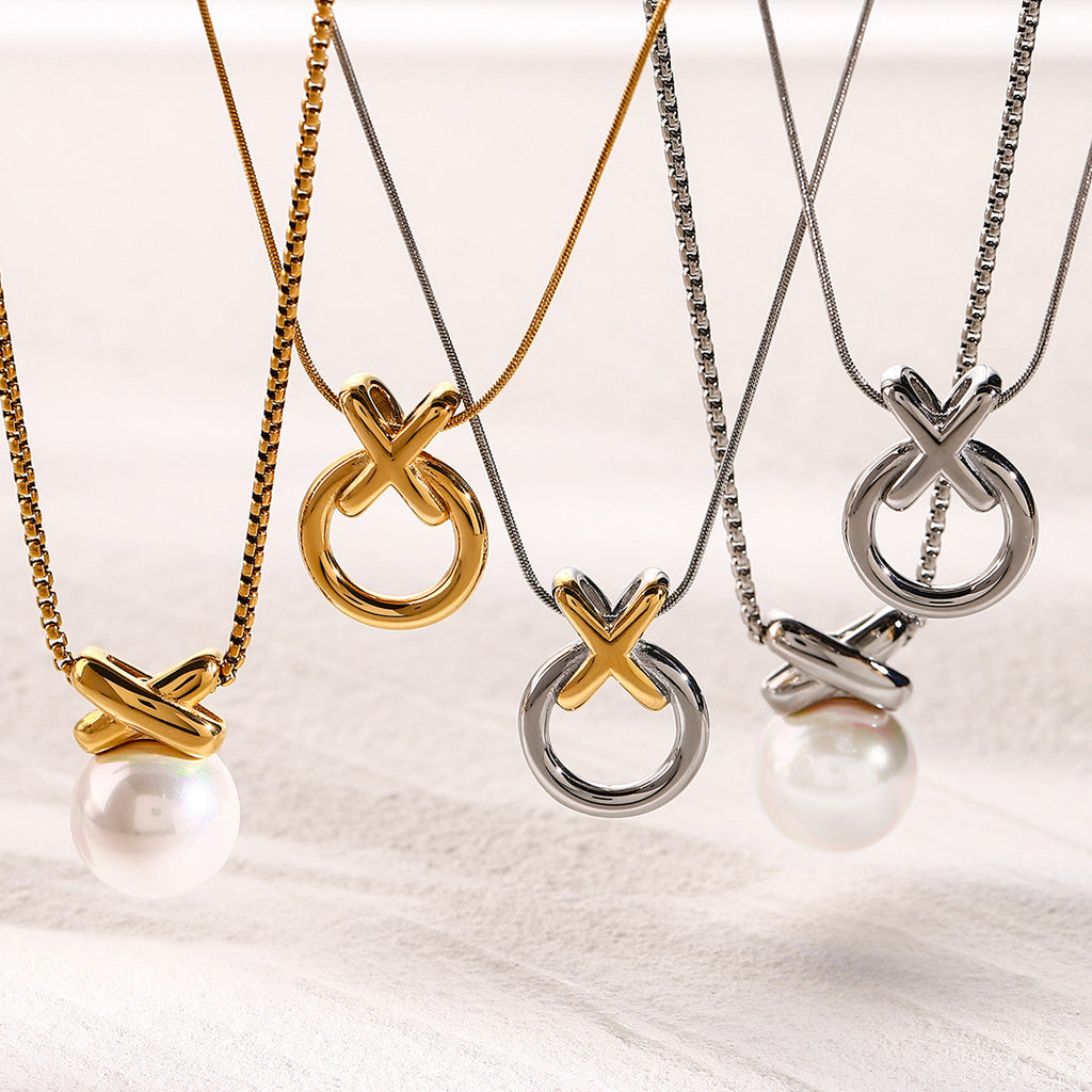 XO circle pendant necklaces shown with pearl-drop reference designs