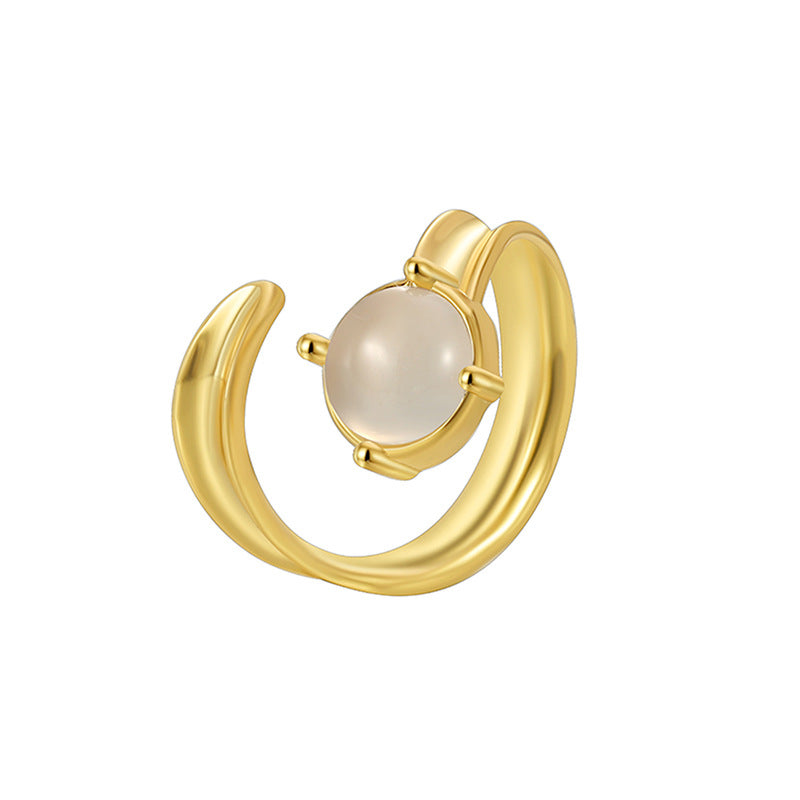 isolated gold plated crescent ring with milky round cabochon