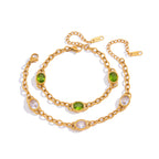 Gold-tone oval-link bracelets on white