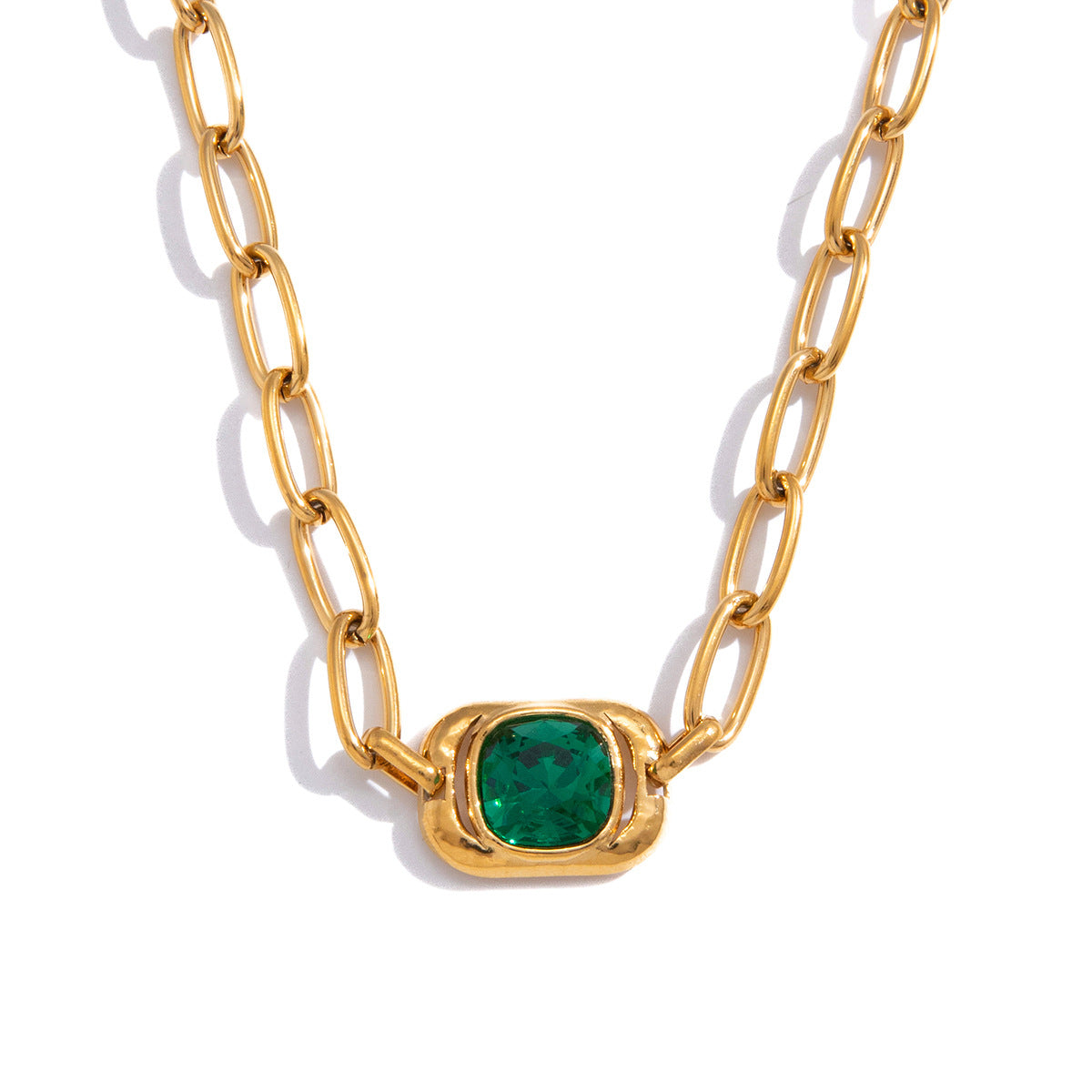 isolated stainless steel link necklace with green glass center