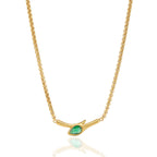 Front view of curved gold tone bar and green stone
